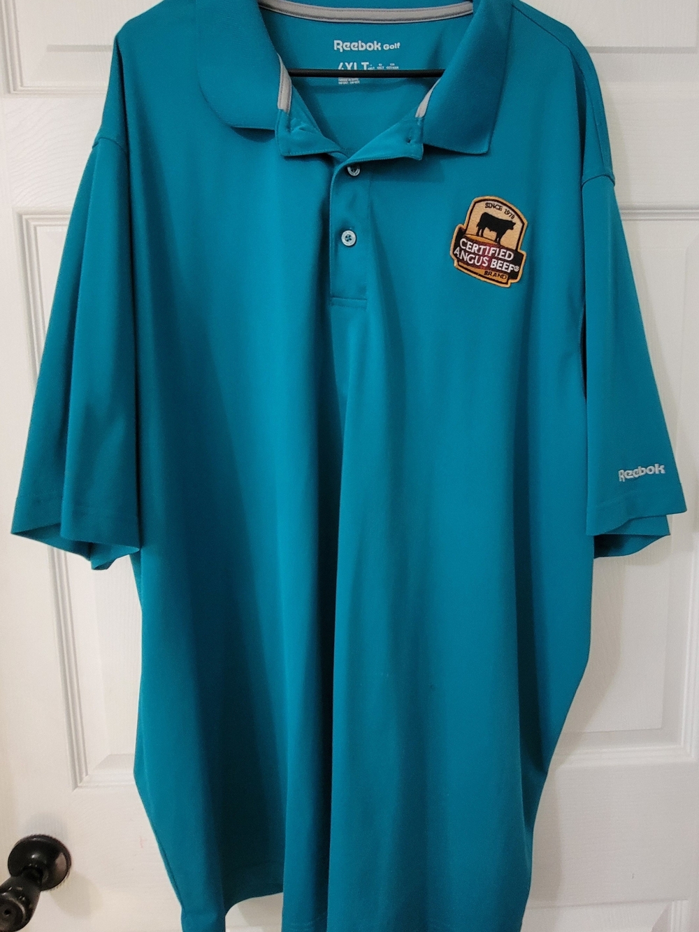 Reebok Men’s Teal Polo with Certified Angus Beef Patch